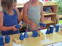 children playing with geometric blocks