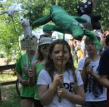 students holding paper mache puppets